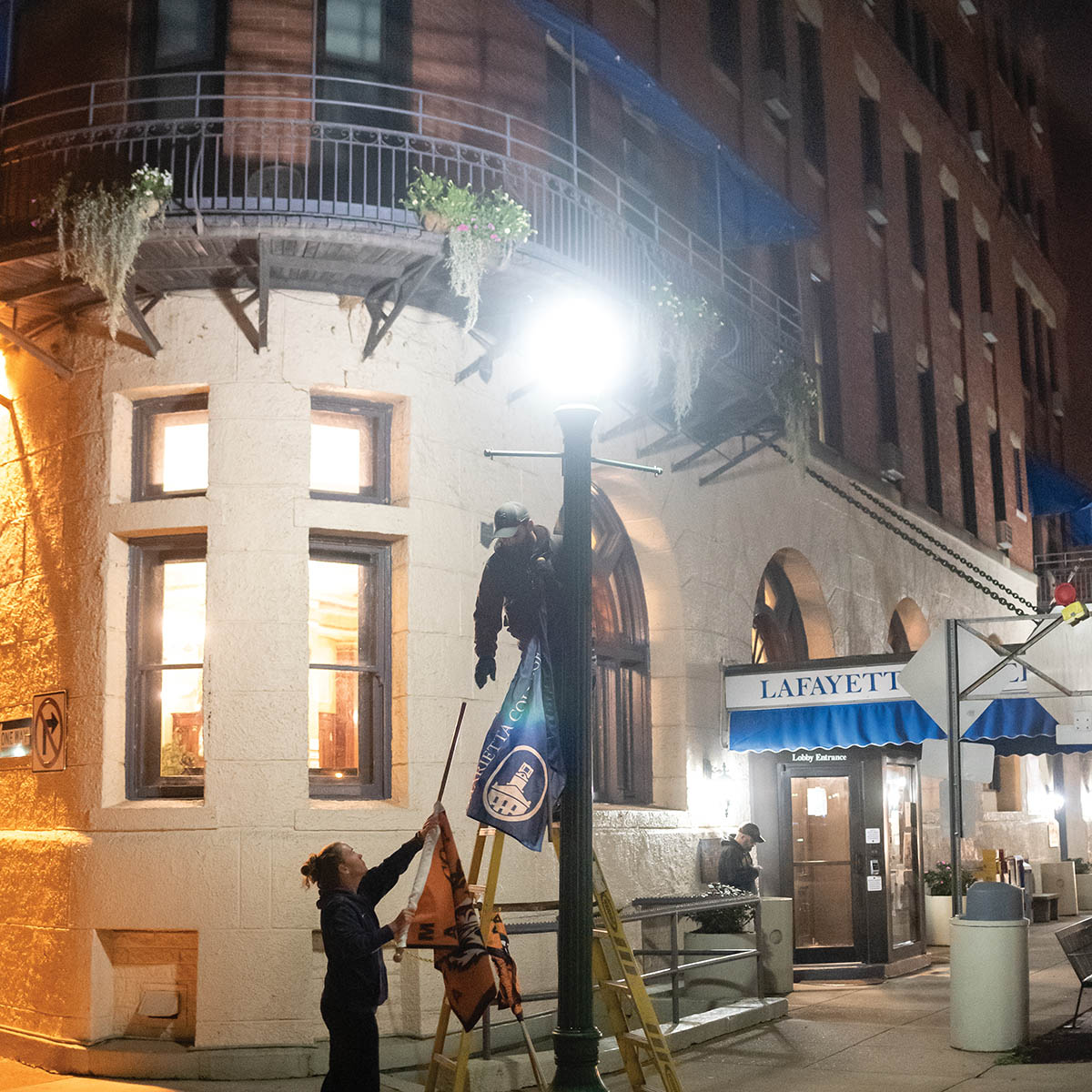 Before dawn, several times each year, Marietta employees volunteer to put up Marietta College flags throughout the downtown district to put Pioneer Pride on full display in the community