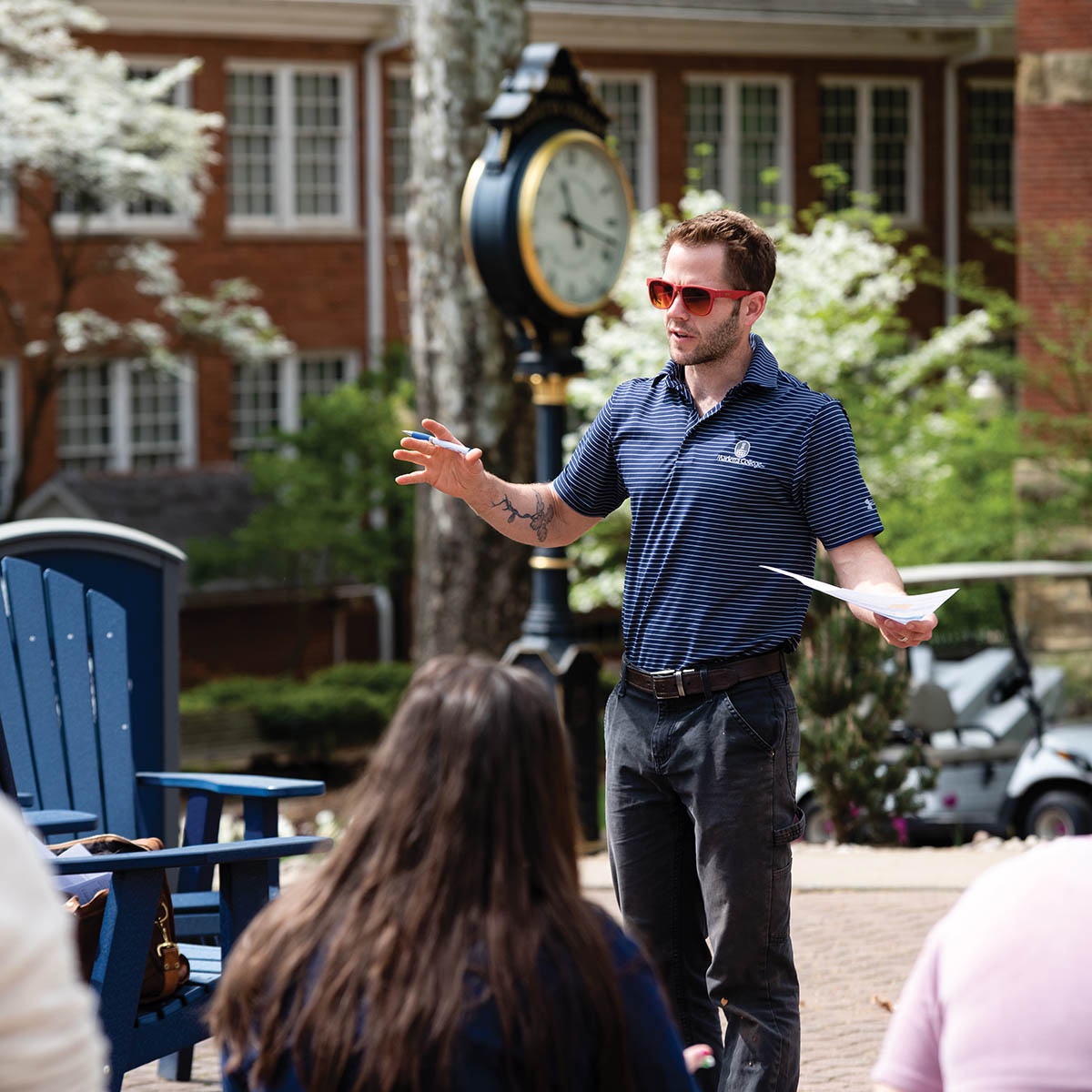 Dr. Erick Carlson, Assistant Professor of Biology, takes advantage of a warm and sunny day in Marietta by taking his class outdoors