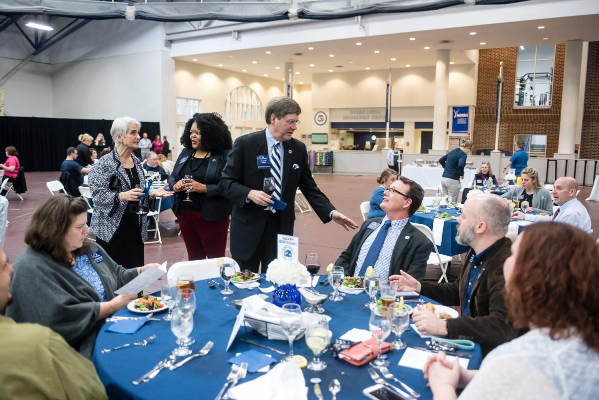 President Ruud Talks with fellow employees at the 2018 Marietta College Founders Day