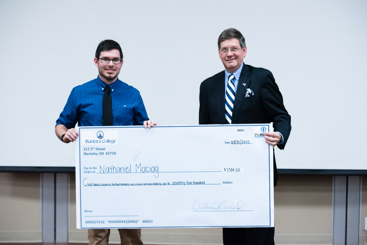 President Ruud presented Nathaniel Maciag ’19 with a check for $7,500 for his project "Slice of Life Bakery."