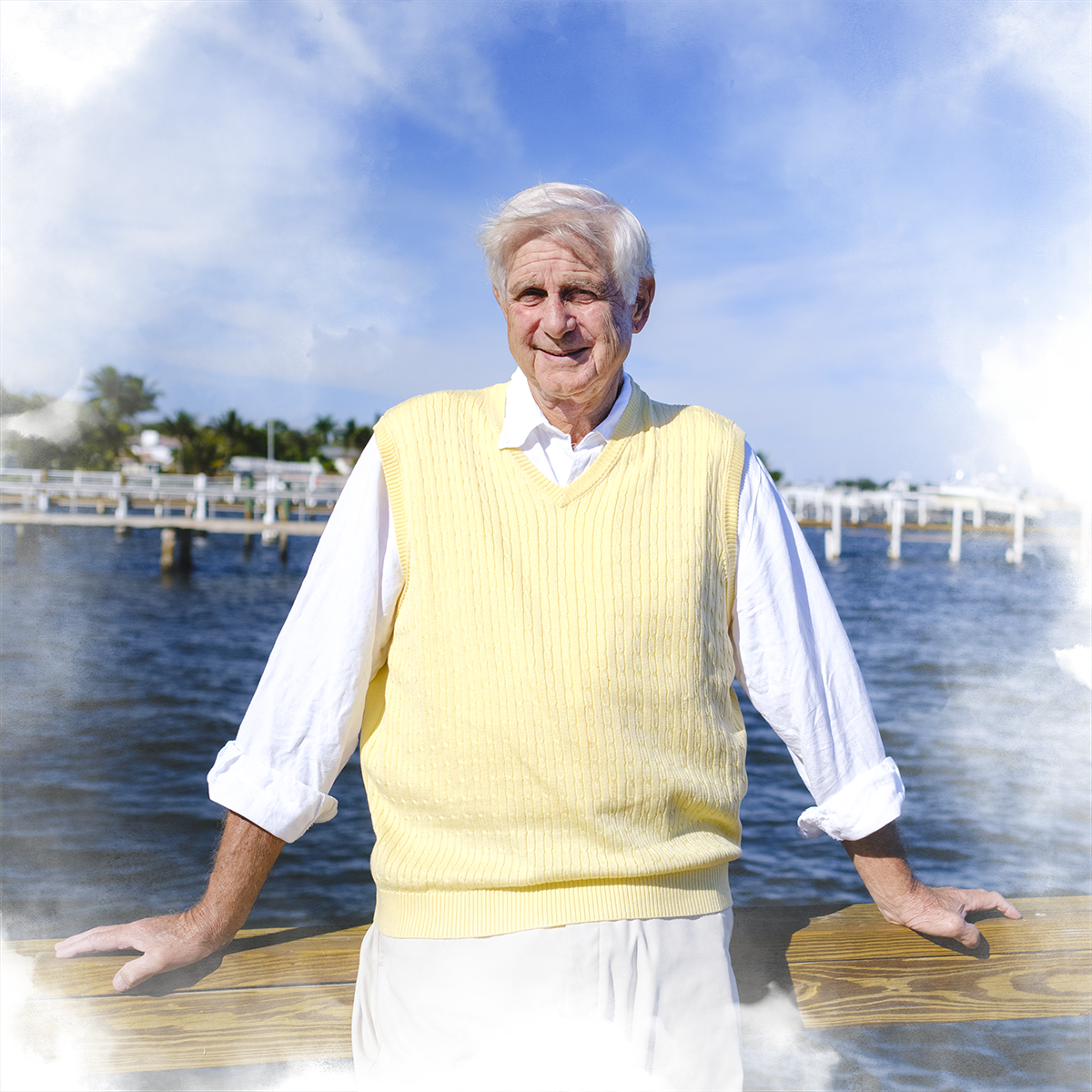 James Byer '66 poses on a boat dock