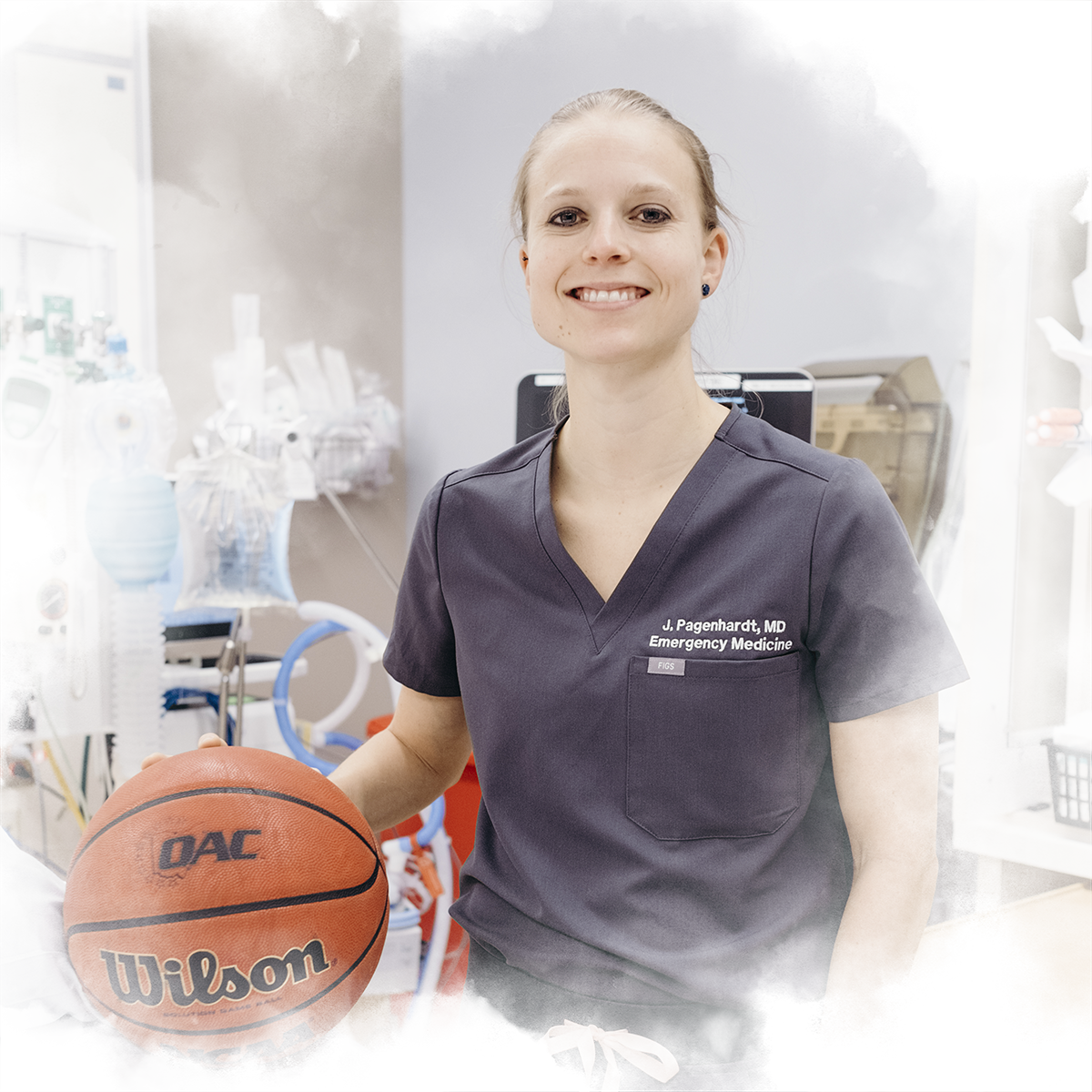 Justine Pagenhardt '08 poses with a basketball in the emergency room where she works