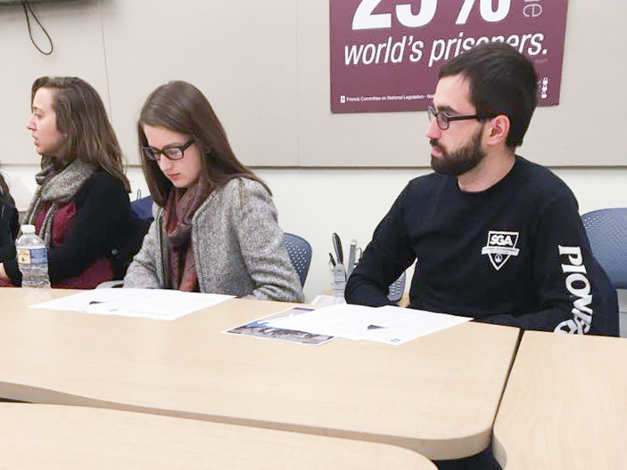 Marietta College students sit at a table for a self learning program through the Office of Civic Engagement
