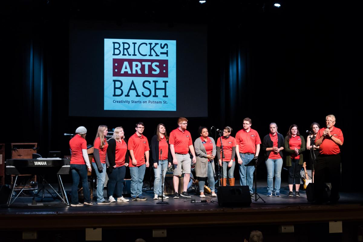 Marshall Kimball (far right) recognized the Brick Street Arts Bash planning committee, made up of Marietta College students, for their months of work leading up to the event