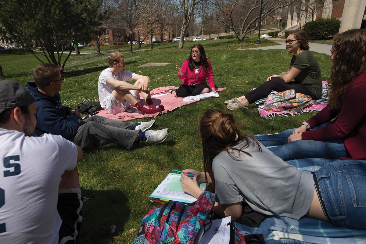 Instructor Ann Kaufman found the perfect place to conduct her Education class earlier this spring - on the lawn in front of Erwin Hall