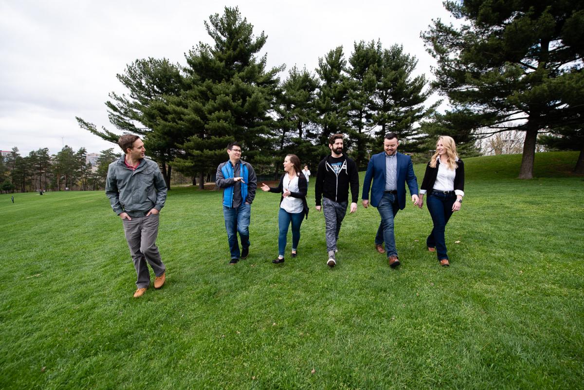 Pittsburgh Alumni walk through a park together