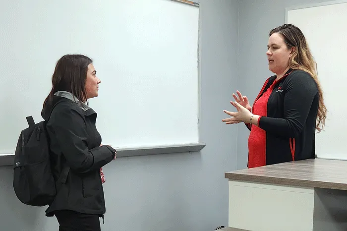 Student speaking with presenter