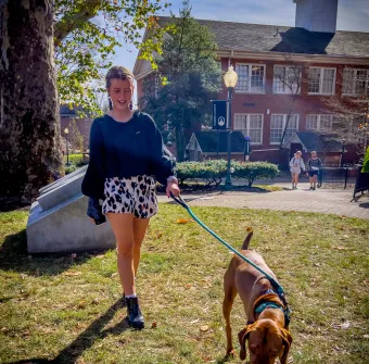 A Marietta College student walks their dog during a de-stress with dogs event