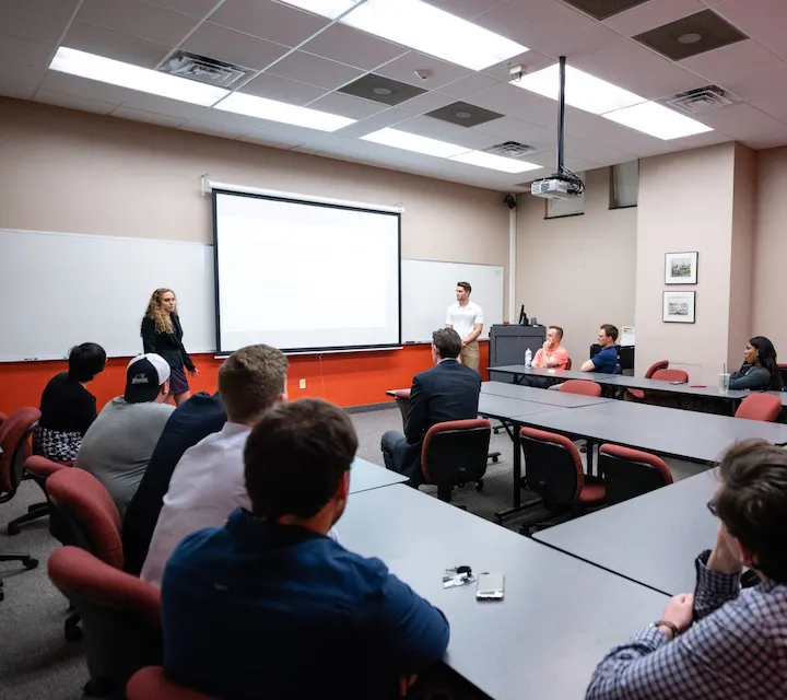 Two Marietta College students present during class