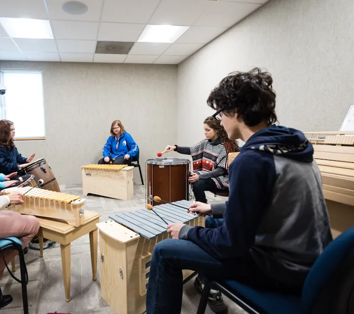Marietta College Music Therapy majors playing instruments
