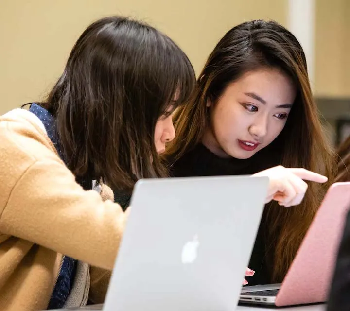 A Marietta College Writing Center tutor helps another student