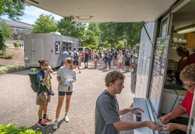 Marietta College students gather around a food truck on the Christy Mall