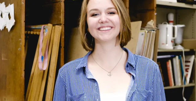 Leah Seaman smiling in art classroom