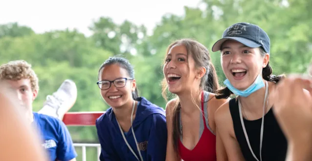 Three female students laughing