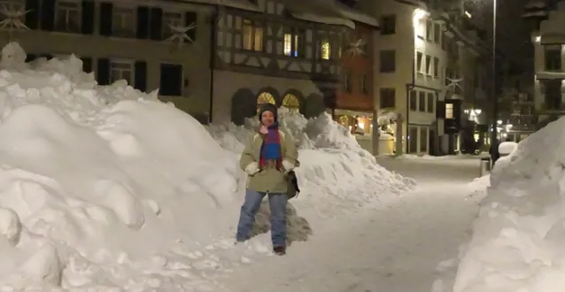 Grace Johnson standing in the snow in Switzerland