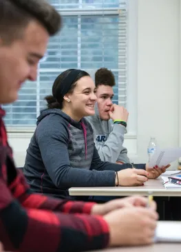 A Marietta College student majoring in journalism and broadcasting laughs during a class discussion