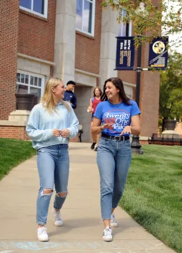 Marietta College students walking in front of Legacy Library
