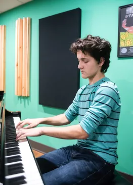 A Marietta College Music Therapy major playing piano.