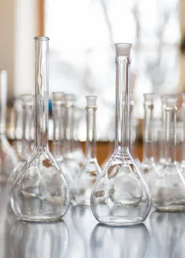 Beakers sitting on a table in a Chemistry classroom.