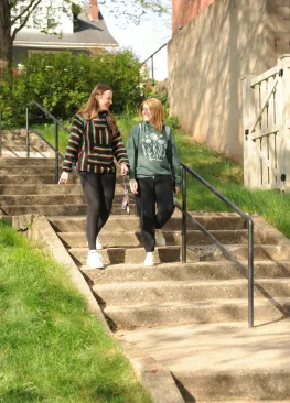 Marietta College students walking down steps beside Mills Hall