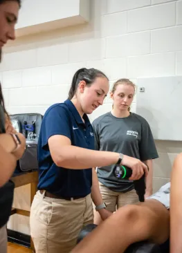 A Marietta College Master of Athletic Training student works on an athlete