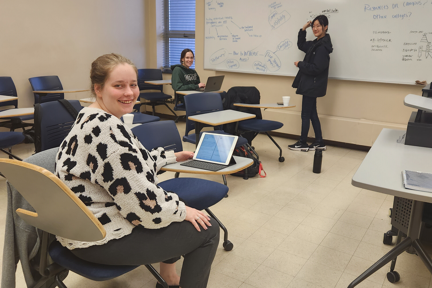 PioSolve third-place award recipients Nichole Boone, Emily Jones, and Kanae Yoshida working on their proposed project âPIO 202: Break the Stigmaâ
