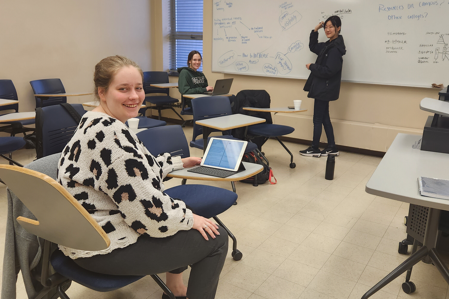 PioSolve third-place award recipients Nichole Boone, Emily Jones, and Kanae Yoshida working on their proposed project âPIO 202: Break the Stigmaâ