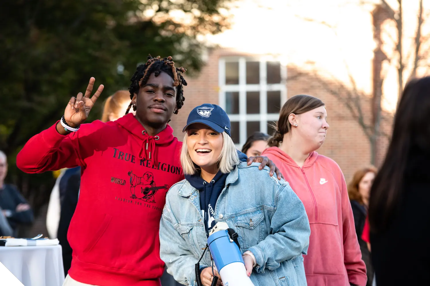 Two Marietta College student pose in front of the Legacy Library