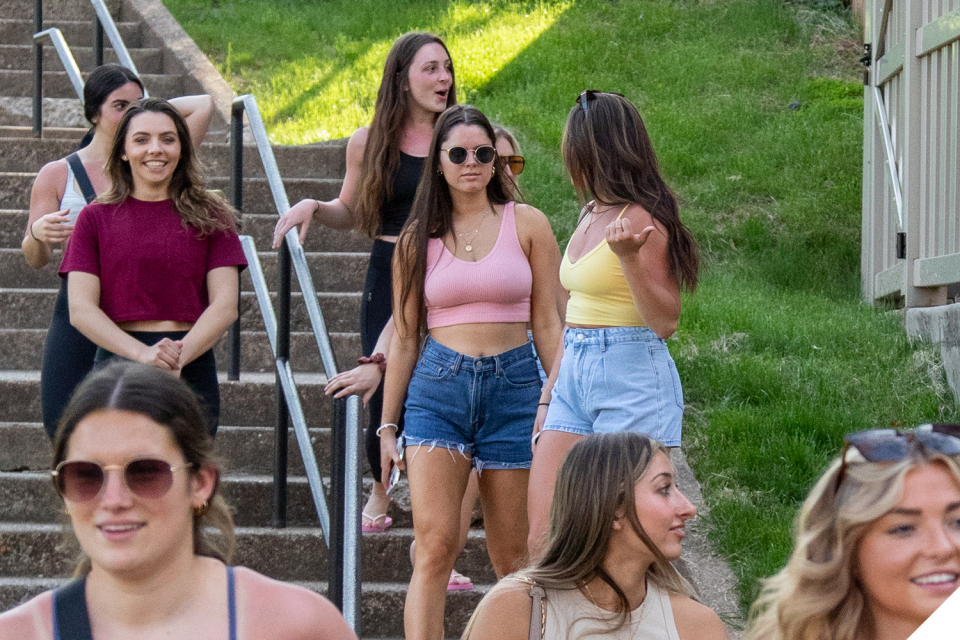 Students walk down the stairs outside Mills Hall