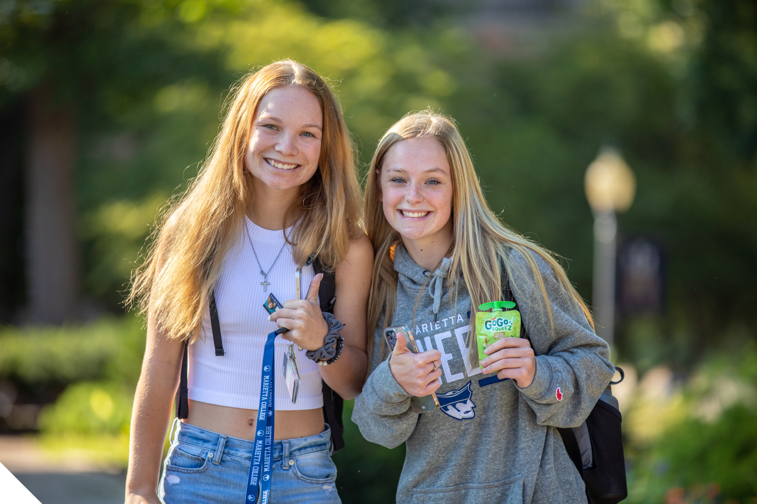 Two Marietta College students pose in front of the Legacy Library