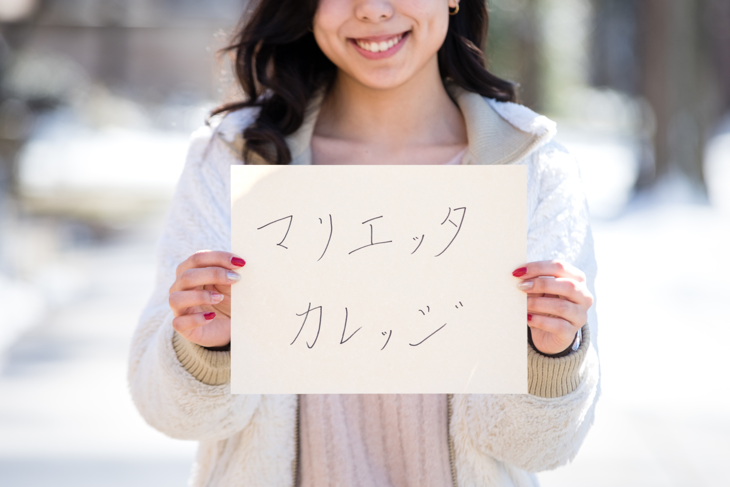 A Marietta College student holding a sign