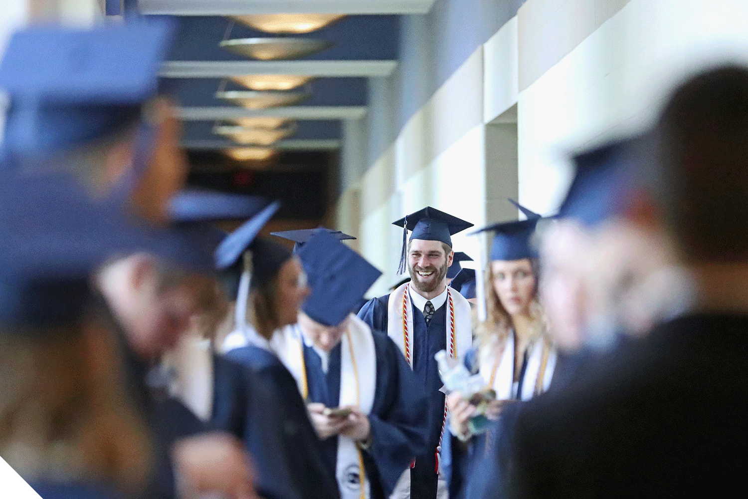 Marietta College students in caps and gowns before Commencement