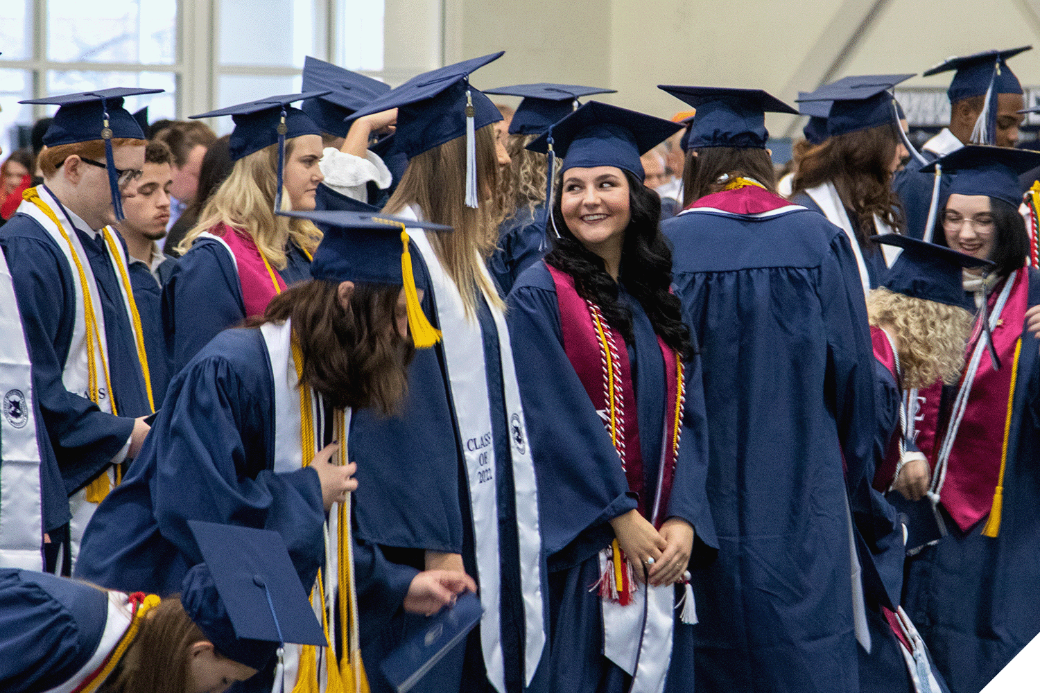 Marietta College graduates stand during December graduation