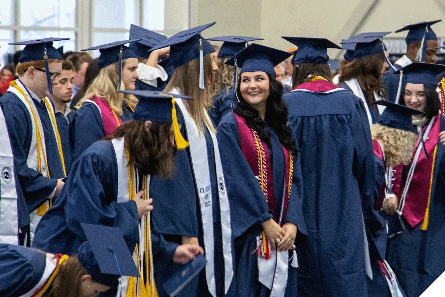 Marietta College graduates stand during December graduation