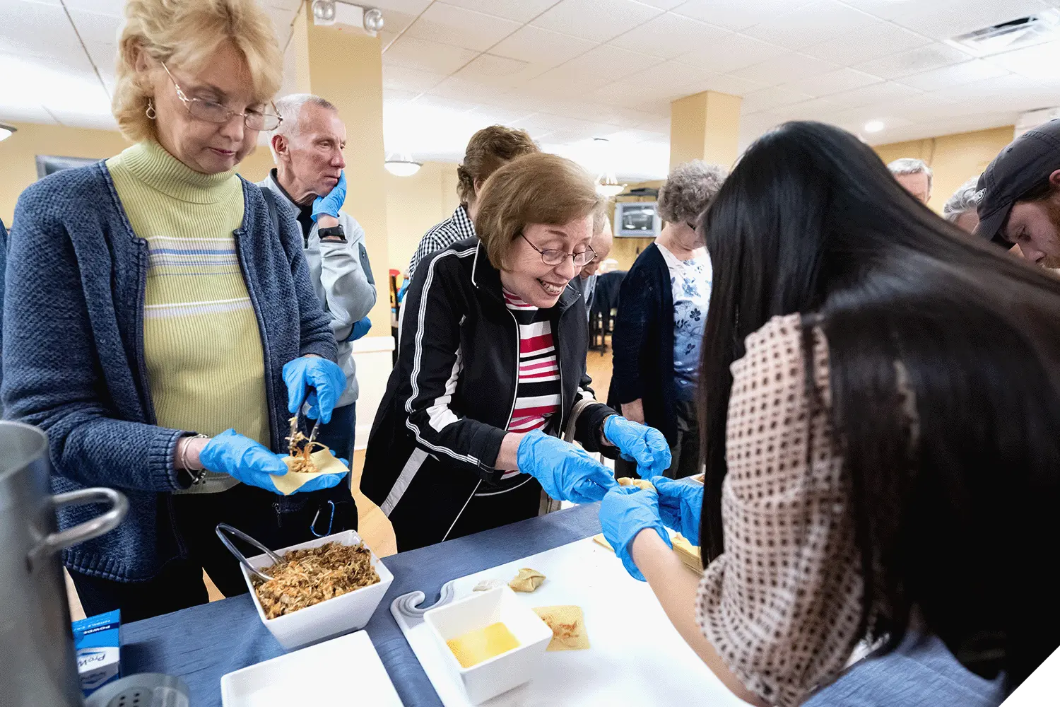 Marietta College Institute for Learning in Retirement students make wontons as part of a class
