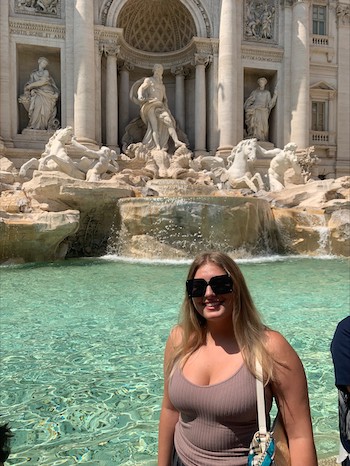 Marietta College student Aurora Bernhardt ’24 stands in front of the Trevi Fountain during her Education Abroad experience in Italy