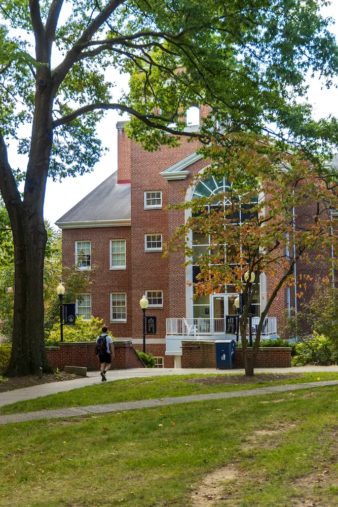 A Marietta College student walking toward the Rickey Science Center