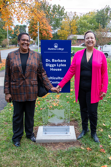 Lauri Lyles and Jocelyn Lyles (left) celebrate their late mother during the dedication of the Dr. Barbara Diggs Lyles House and Multicultural Center. Barbara was the first African American woman to graduate from Marietta in 1951