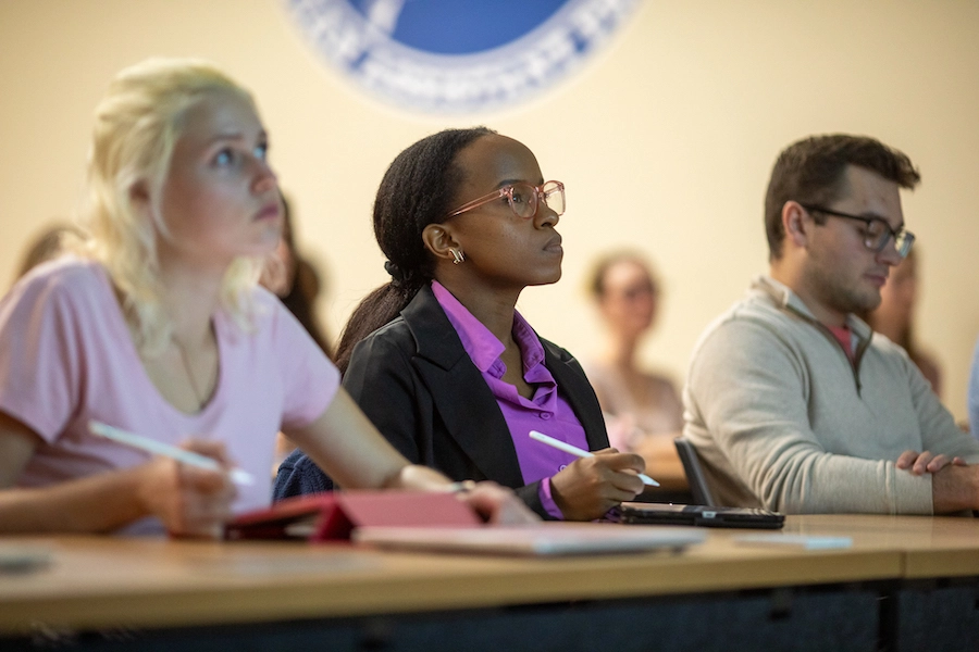 Students in the Marietta College Physician Assistant Program take notes during a lecture