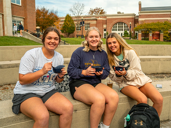 Girls enjoy ice cream on the mall