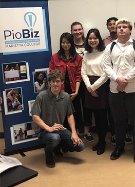PioBiz participants with event signage