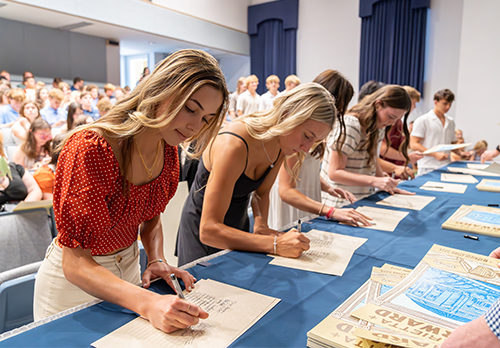 First-year student sign into the College record at matriculation