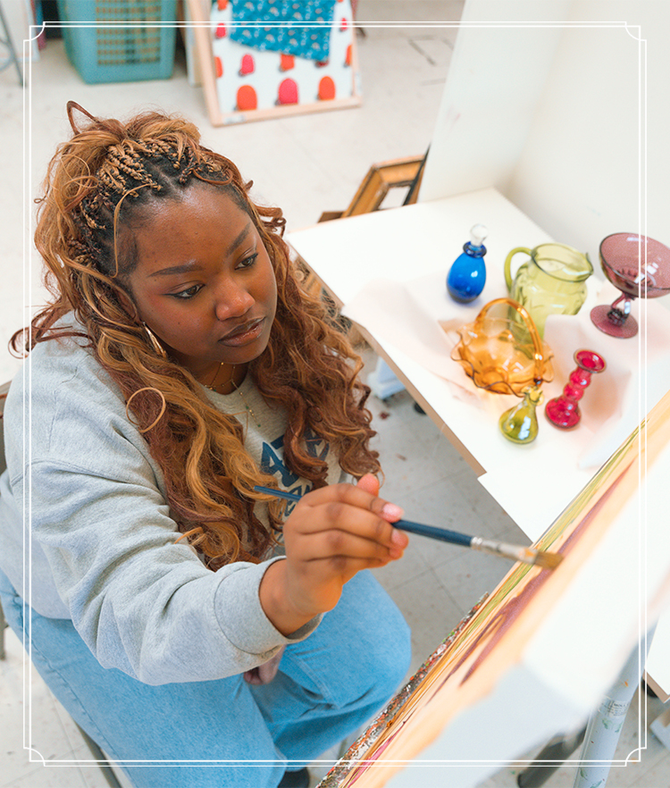 Student painting in art class