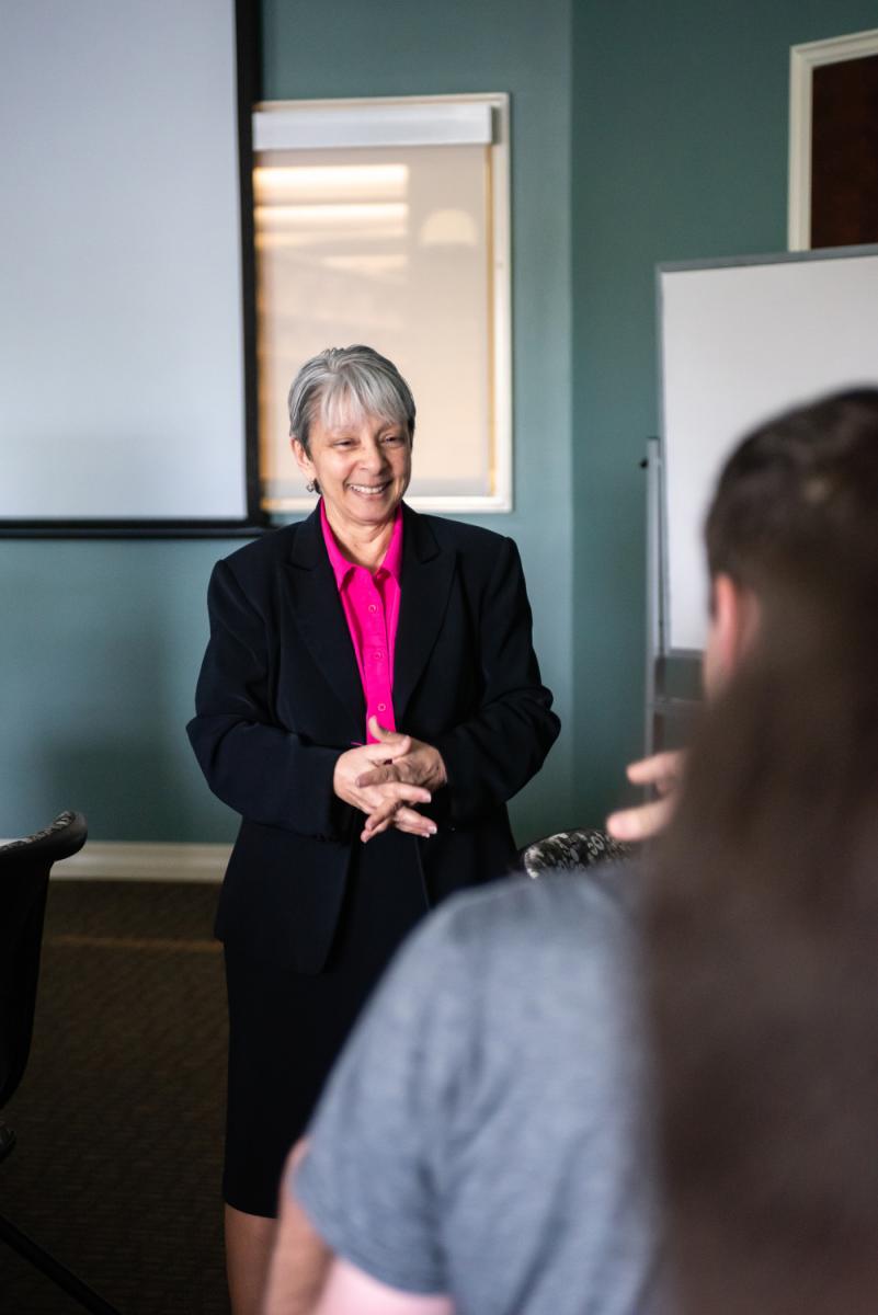 Grace Johnson smiling while teaching a class