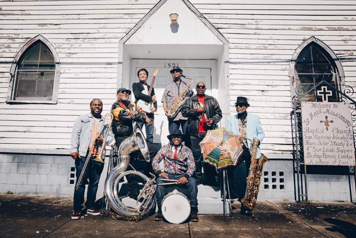 Band in front of a house