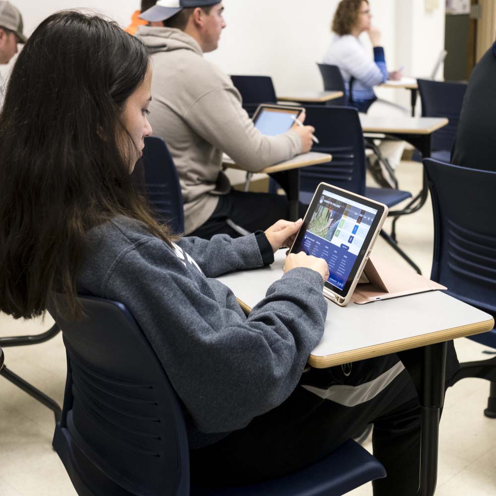 Student with iPad in classroom