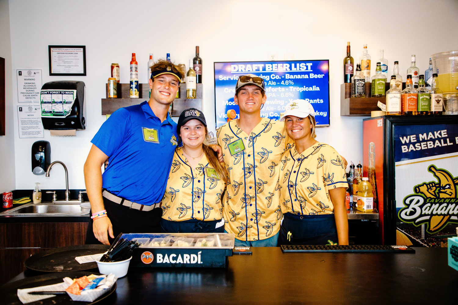 Marietta COllege student pose in the bar of the Savannah Bananas