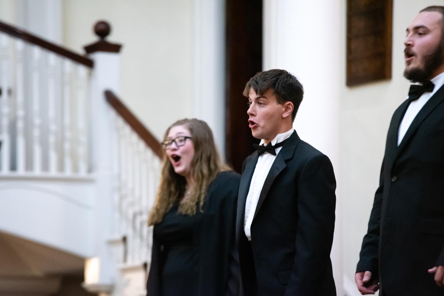 Marietta College Concert Choir members sing at a concert in a nearby church