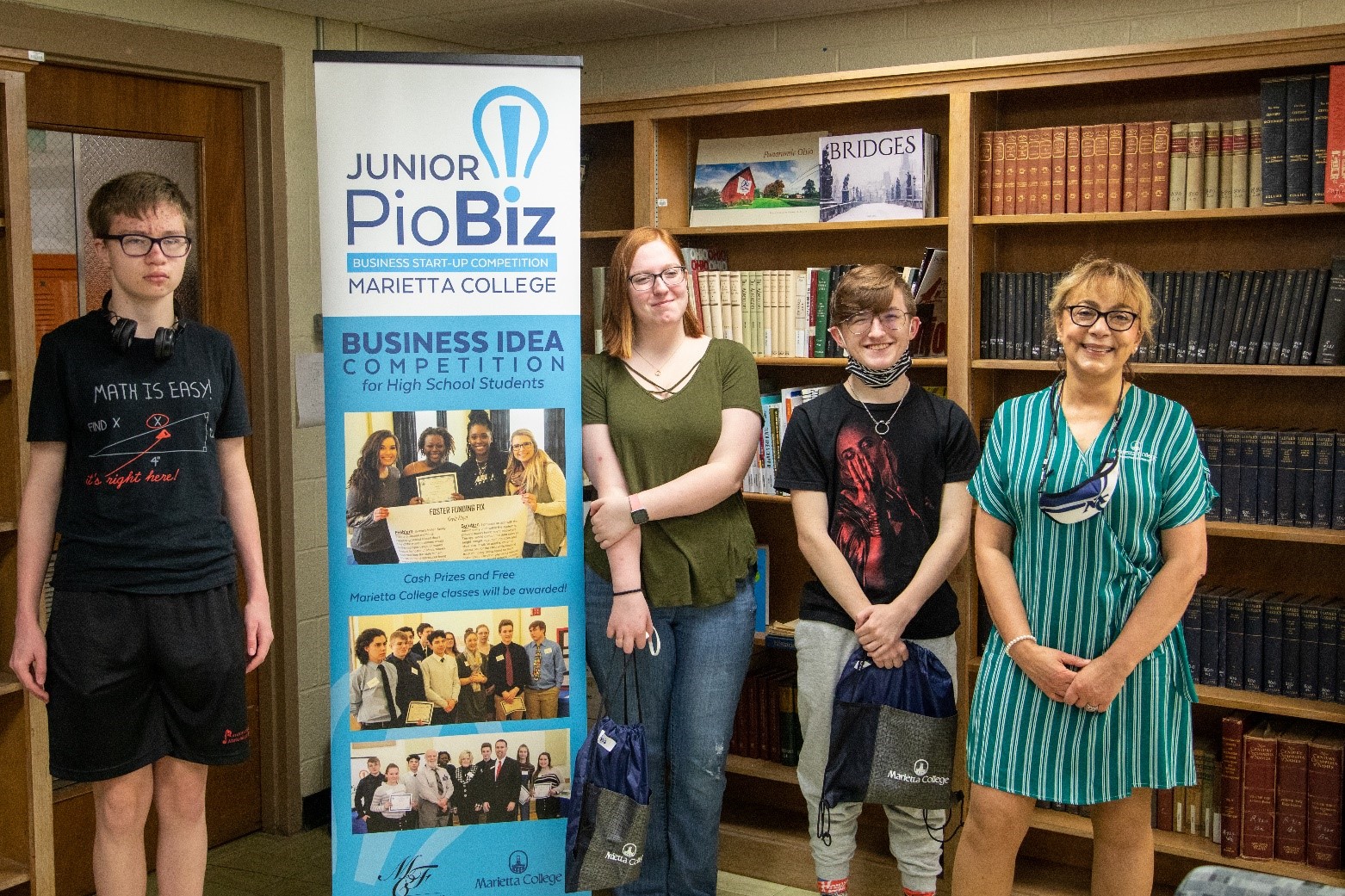 Dr. Khorassani visited Belpre High School to present the second-place award to Evan Vowls, Alivia Mercer and Wyatt Whitehouse for their “Instrufinder” project.