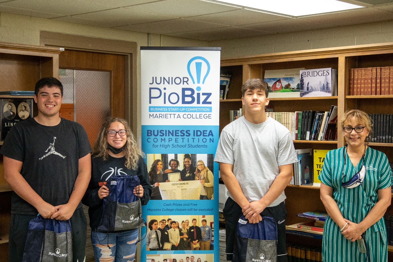 Dr. Khorassani visited Belpre High School to present the third-place award to Nichole Gogan, Victor Vilahur, and Elijah Flowers for their "Ouickassist” projec